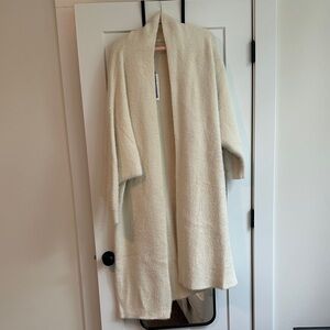 Seen on her oversized cardigan